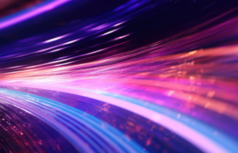 Vibrant streaks of light in blue, pink, and purple hues creating a dynamic motion effect.
